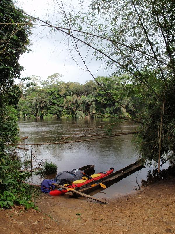 P15 Our kayak next to its African cousins and brothers. Second camp in village at approx 40 km's out of Lodja..jpg